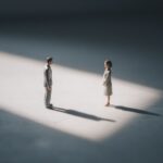 two toy workers, moody lighting