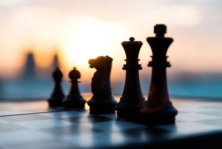 Chess pieces on display on a chess board