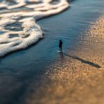 toy figure on the beach
