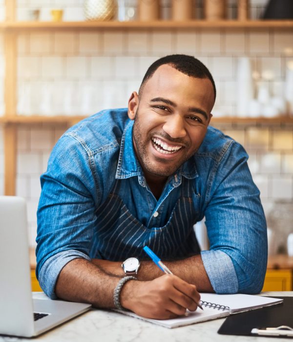 Cropped portrait of a handsome young man working in his coffee shop